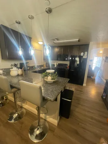 a room with lots of chairs and mirrors