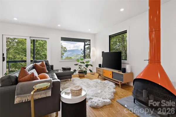 a living room with furniture and a flat screen tv