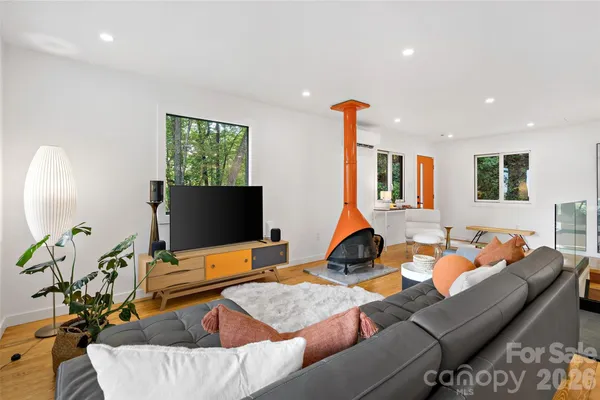 a living room with furniture and a large window