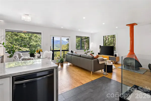 a kitchen with stainless steel appliances granite countertop a refrigerator sink and stove