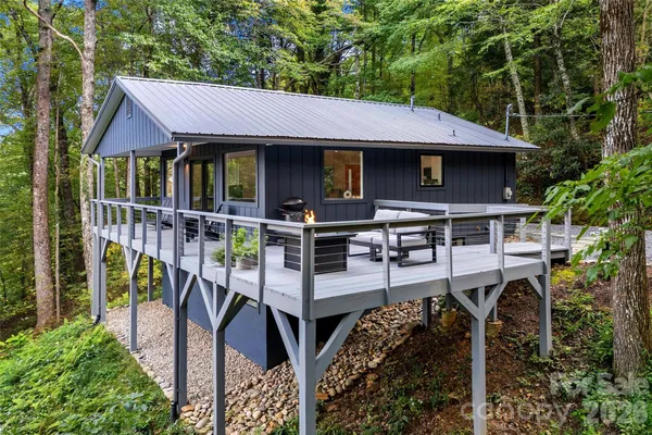 a view of house with outdoor seating area