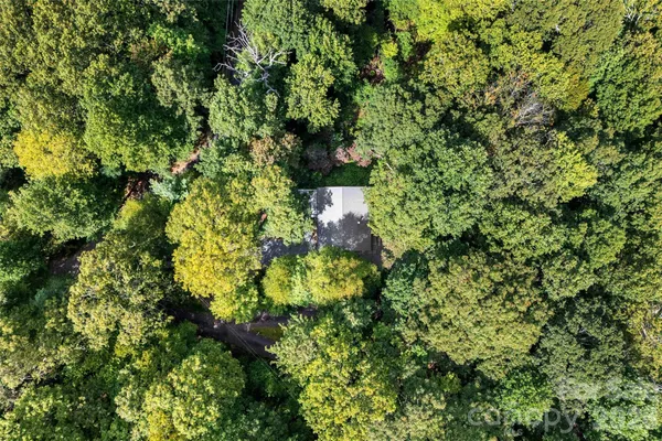 a view of a backyard with sitting area