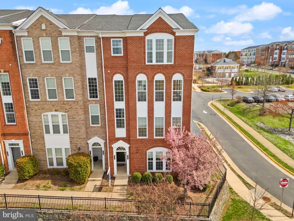 an aerial view of a residential apartment building with a yard