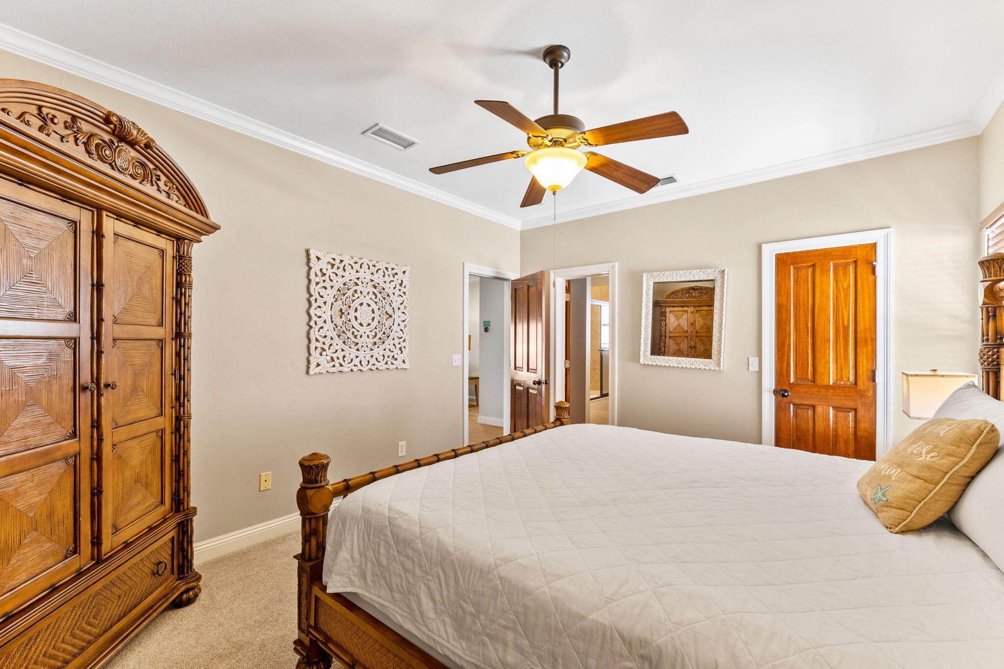 211 Grand Key Loop East Destin, FL 32541 - Photo 23 of 28 a bedroom with a bed and a chandelier