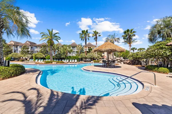a view of a swimming pool with a lounge chair