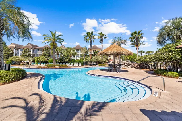 a view of a swimming pool with a lounge chair