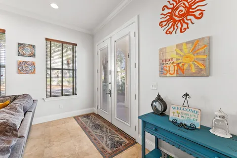 a bedroom with furniture and a window