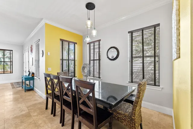 a view of a dining room with furniture and window