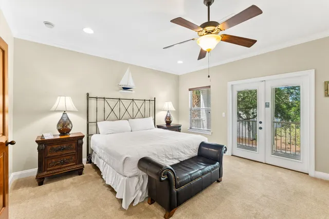 a spacious bedroom with a bed and window