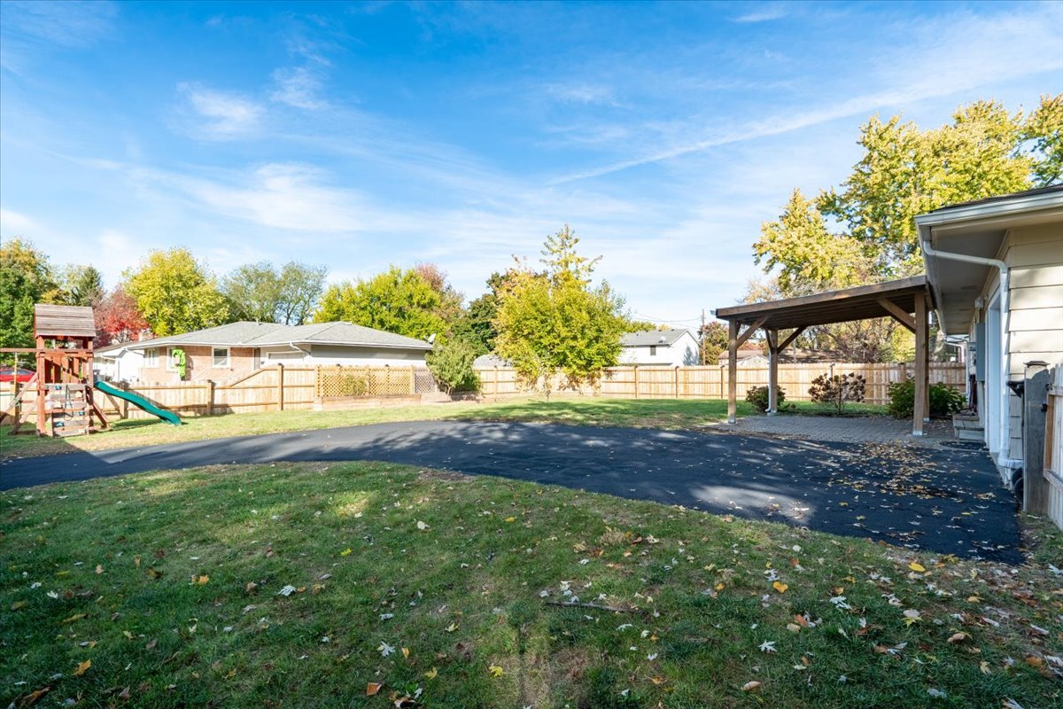 305 Highpoint Road Normal, IL 61761 - Photo 25 of 29 a view of yard with swimming pool and green space