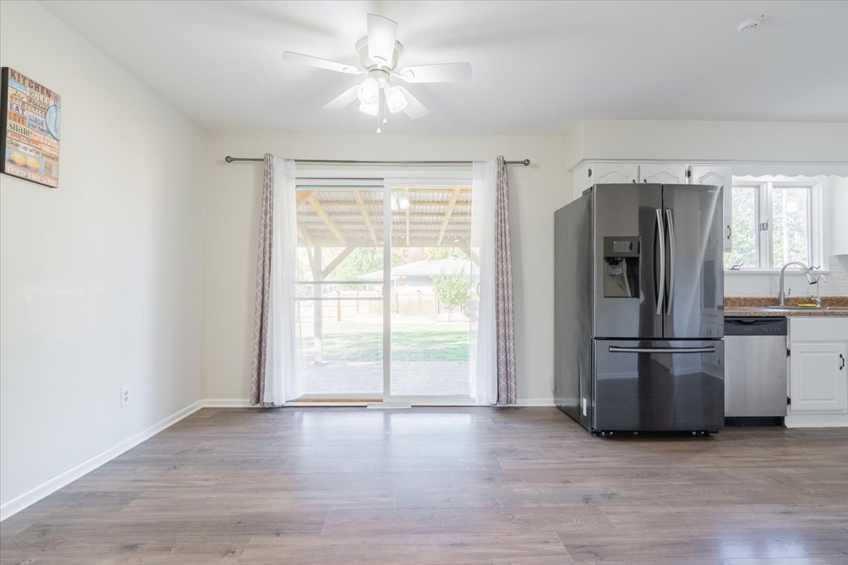 305 Highpoint Road Normal, IL 61761 - Photo 6 of 29 a view of a kitchen with a stove fridge and wooden floor