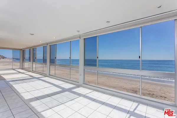 a view of a room that has a large window