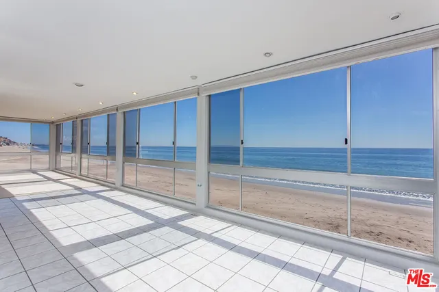 a view of a room that has a large window