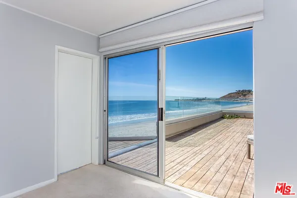 a view of a livingroom with a lounge chair and painted walls