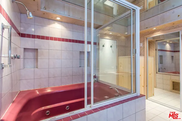 a bathroom with a glass shower door