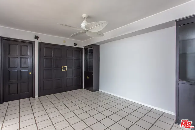 a bathroom with a shower and a mirror