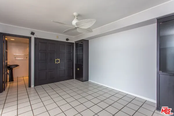 a bathroom with a window and a shower