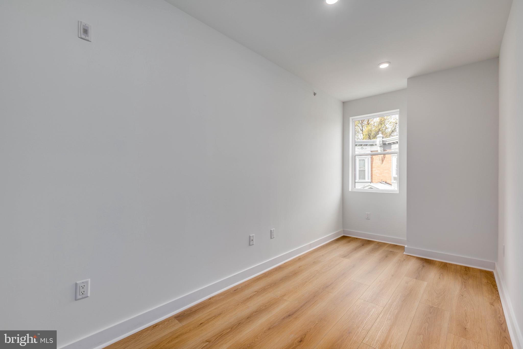 1224 West Silver Street, Unit 2 Philadelphia, PA 19133 - Photo 2 of 11 a view of empty room with wooden floor and fan
