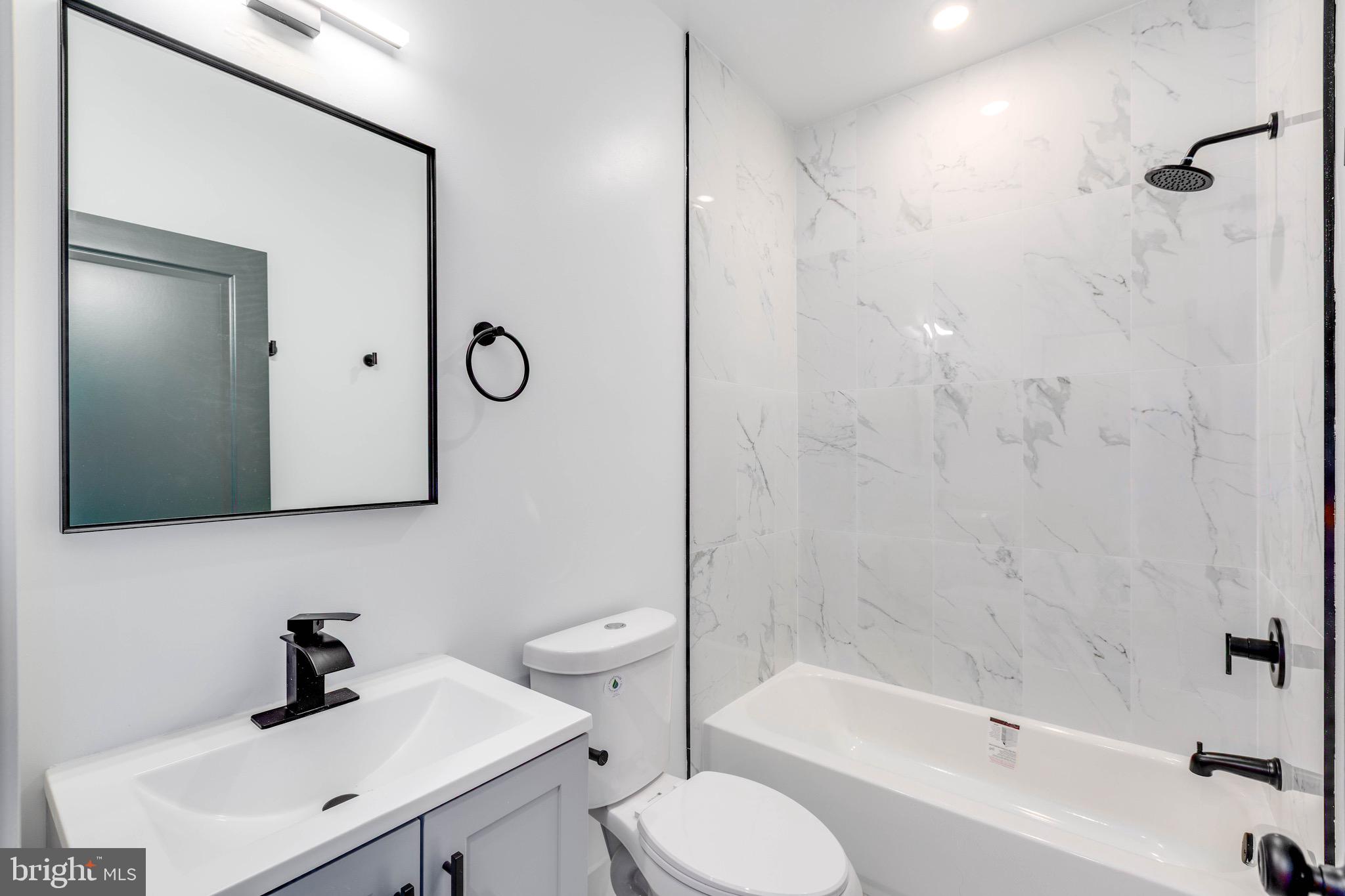 1224 West Silver Street, Unit 2 Philadelphia, PA 19133 - Photo 6 of 11 a bathroom with a sink toilet and shower