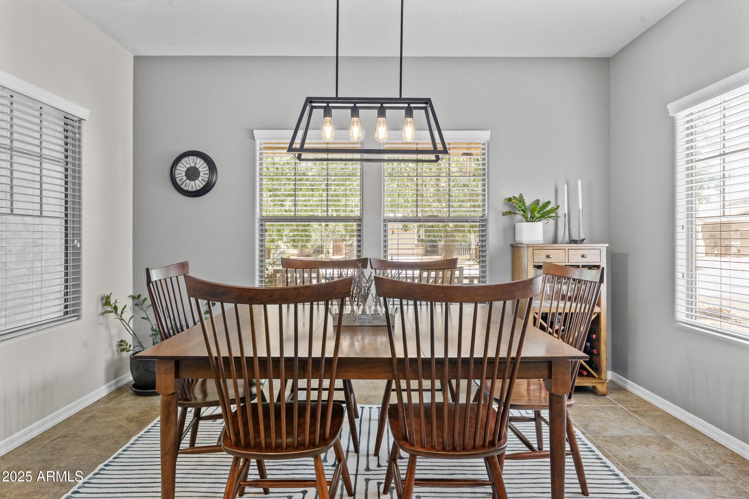 5303 West Hackamore Drive Phoenix, AZ 85083 - Photo 13 of 33 a view of a dining room with furniture window and wooden floor
