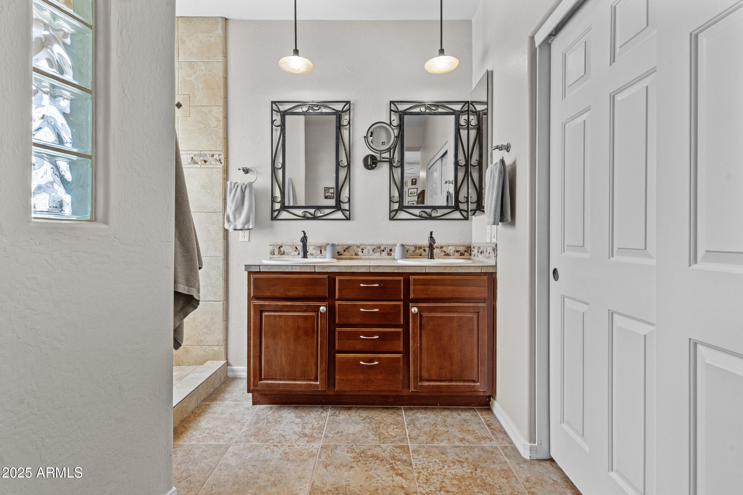 5303 West Hackamore Drive Phoenix, AZ 85083 - Photo 16 of 33 a bathroom with a granite countertop double vanity sink and a mirror
