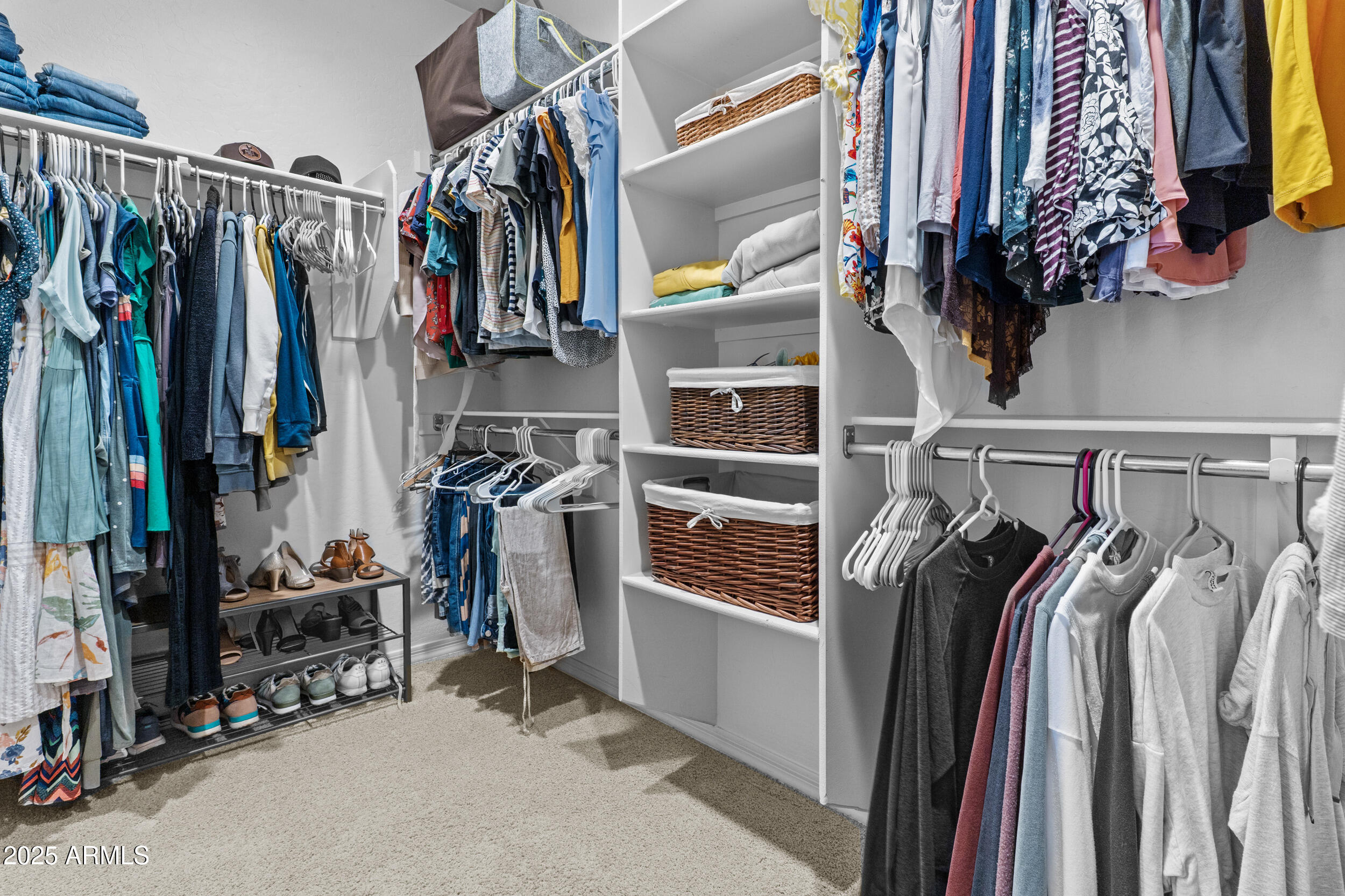 5303 West Hackamore Drive Phoenix, AZ 85083 - Photo 18 of 33 a view of walk in closet with clothes and shoes
