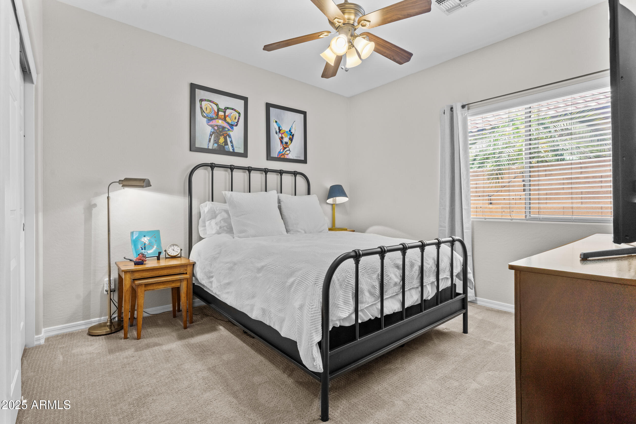 5303 West Hackamore Drive Phoenix, AZ 85083 - Photo 20 of 33 a bedroom with a bed and a chandelier