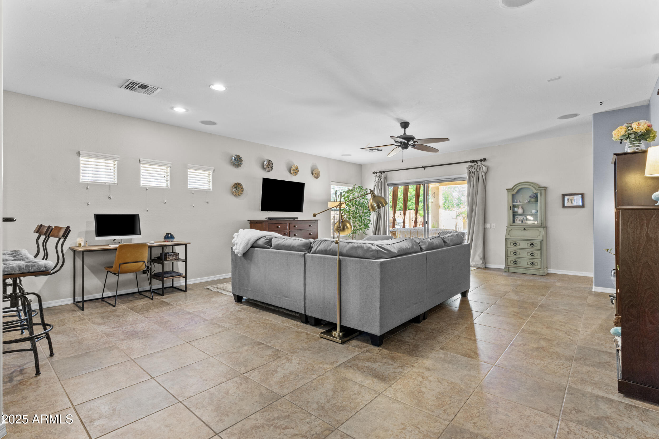 5303 West Hackamore Drive Phoenix, AZ 85083 - Photo 4 of 33 a living room with furniture and a flat screen tv