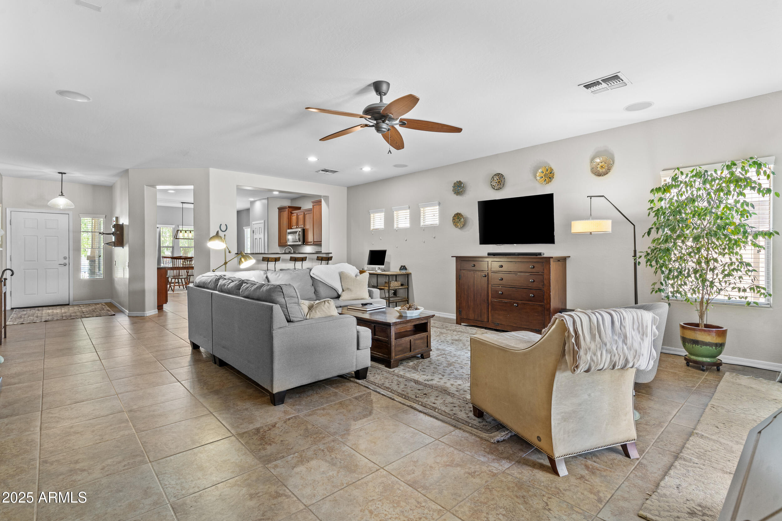 5303 West Hackamore Drive Phoenix, AZ 85083 - Photo 6 of 33 a living room with furniture and a flat screen tv