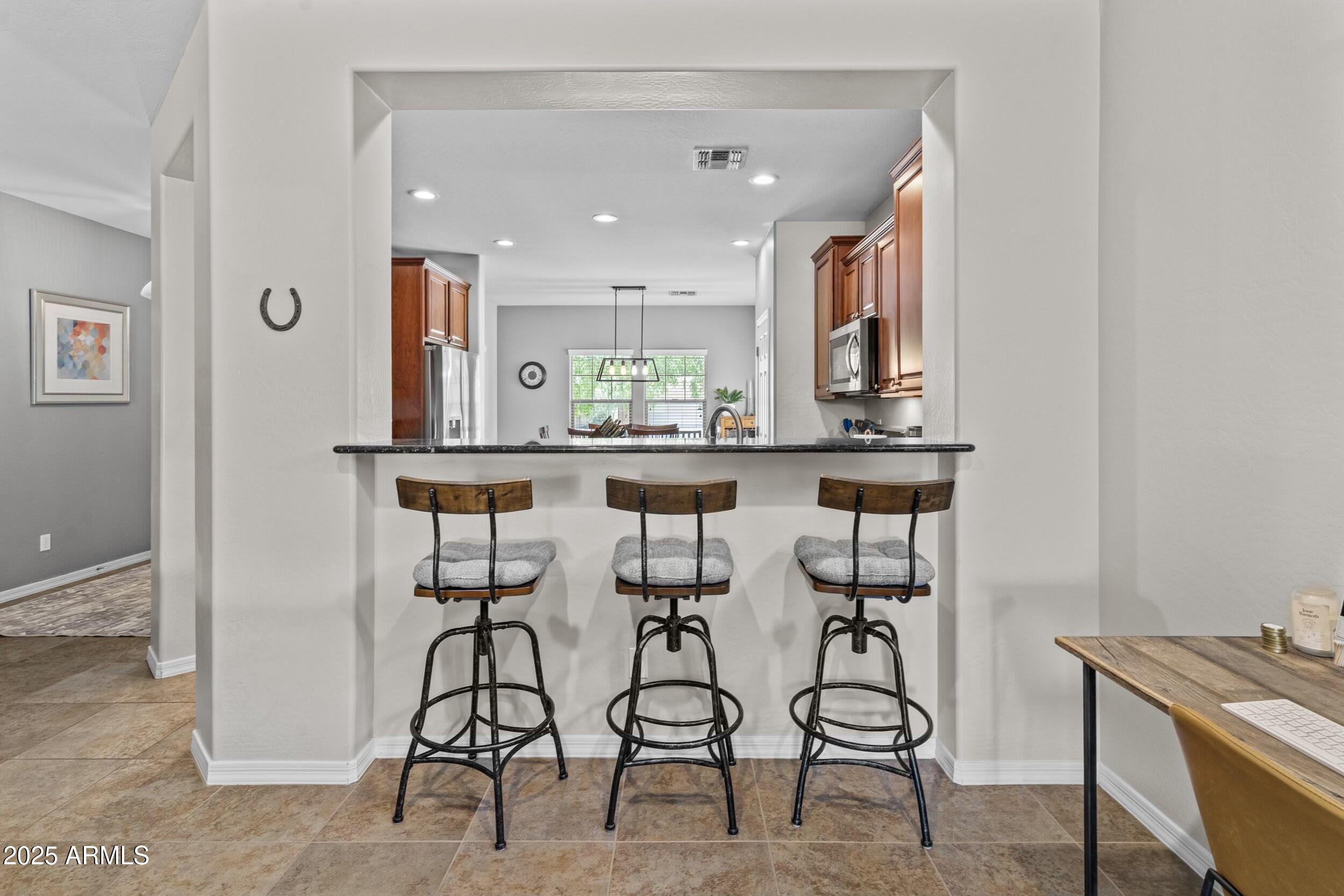 5303 West Hackamore Drive Phoenix, AZ 85083 - Photo 8 of 33 a view of a kitchen and dining area