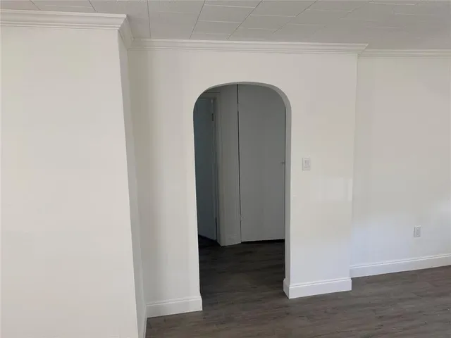 a view of front door with wooden floor