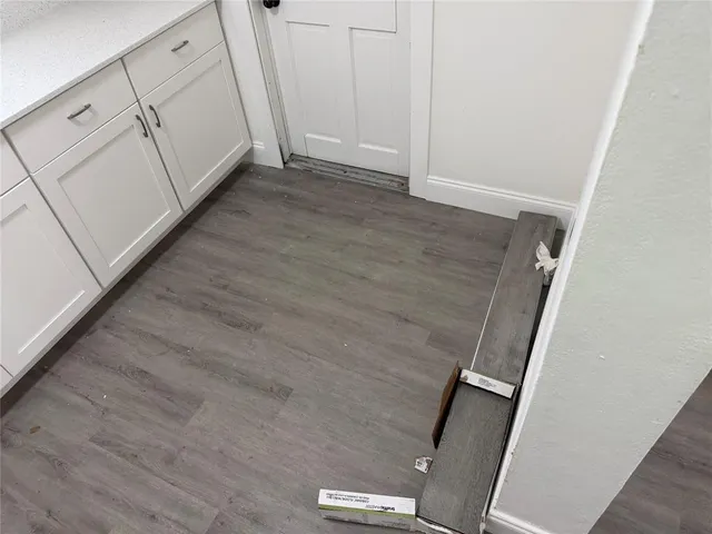 a view of cabinets and wooden floor