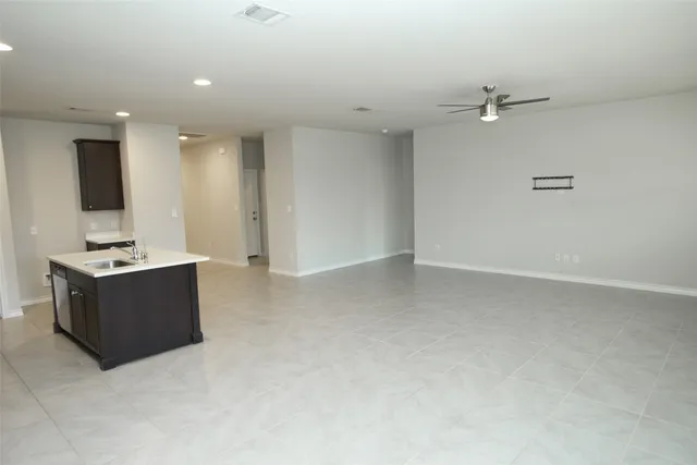 a kitchen with a sink stove and refrigerator