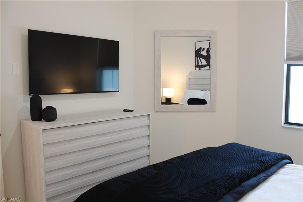 14601 Kingfisher Loop Naples, FL 34120 - Photo 13 of 20 a bathroom with a sink and a mirror