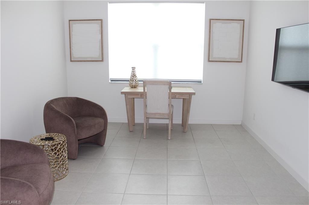 14601 Kingfisher Loop Naples, FL 34120 - Photo 15 of 20 a living room with furniture and a window