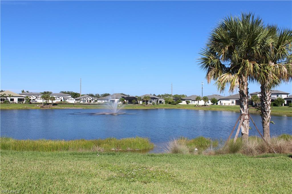14601 Kingfisher Loop Naples, FL 34120 - Photo 18 of 20 a view of swimming pool yard and lake