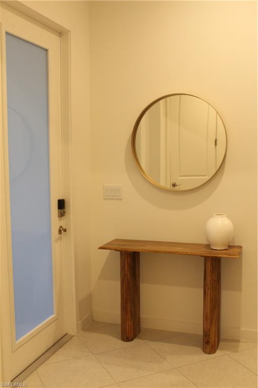 14601 Kingfisher Loop Naples, FL 34120 - Photo 2 of 20 a bathroom with a sink and mirror
