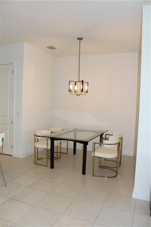 14601 Kingfisher Loop Naples, FL 34120 - Photo 4 of 20 a view of dining room with furniture