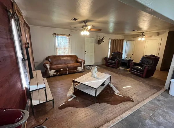 a living room with furniture and a window