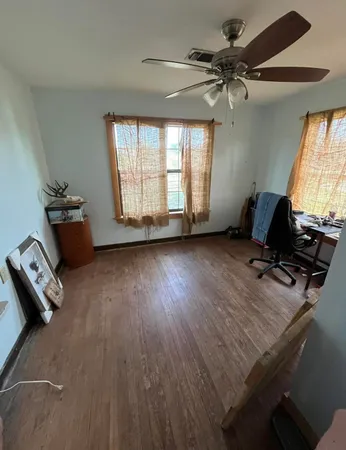 a room with furniture and a wooden floor