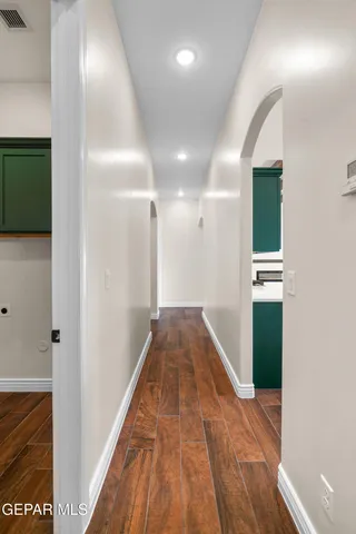 a hallway with wooden floor