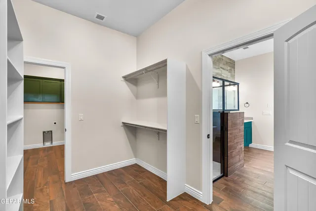 a bathroom with a sink mirror and a bathtub