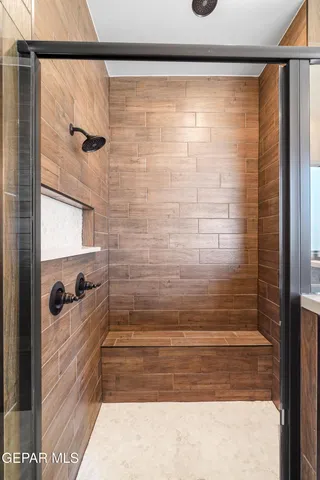 an empty room with wooden floor and window