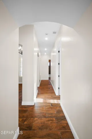 a view of a hallway with white walls