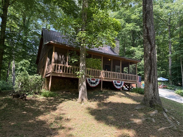238 Trails End Road Blue Ridge, GA 30513 - Photo 31 of 32 a view of a house with a yard deck and a small yard