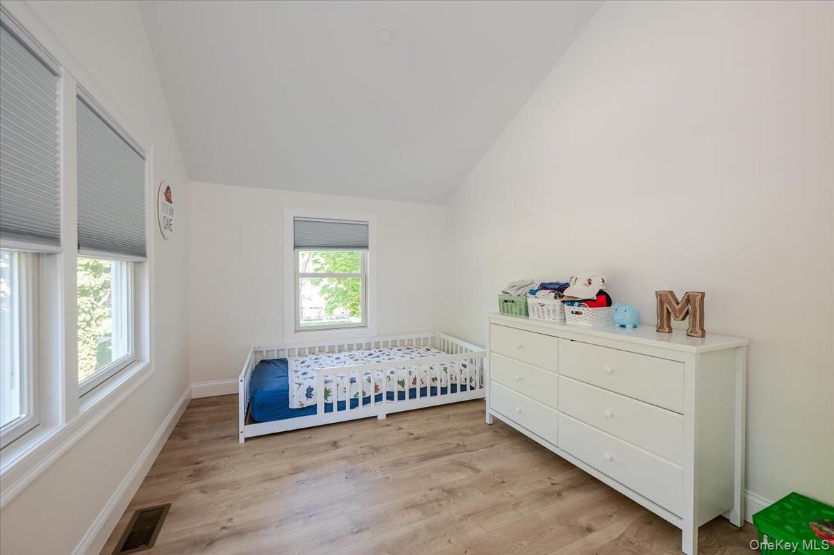 55 Hickory Road Rocky Point, NY 11778 - Photo 12 of 25 a room with a bed and a window