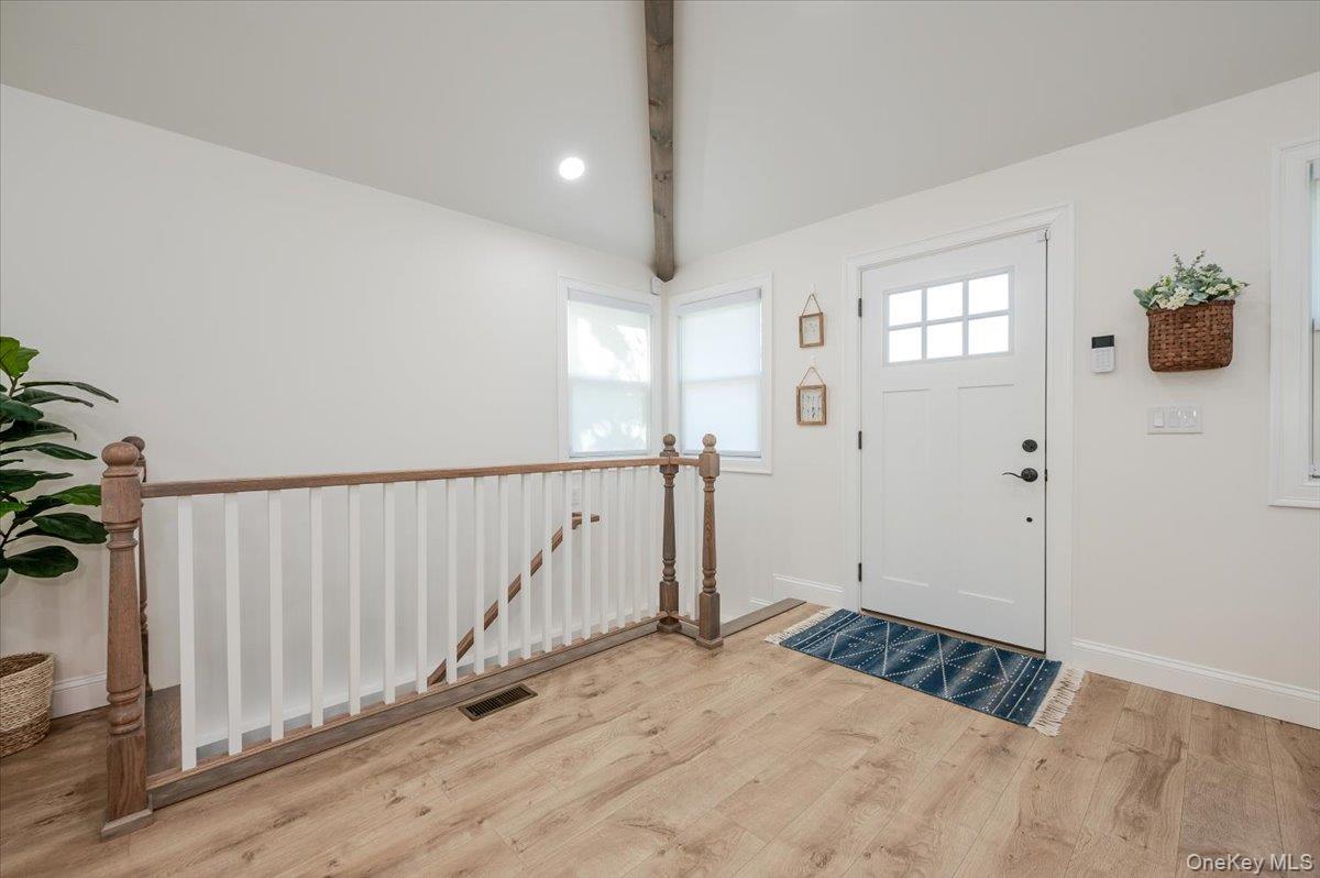 55 Hickory Road Rocky Point, NY 11778 - Photo 2 of 25 a view of a room with wooden floor and windows
