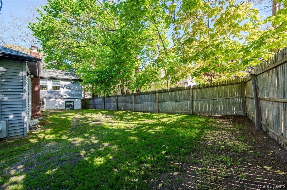 55 Hickory Road Rocky Point, NY 11778 - Photo 24 of 25 a view of a backyard with a trees