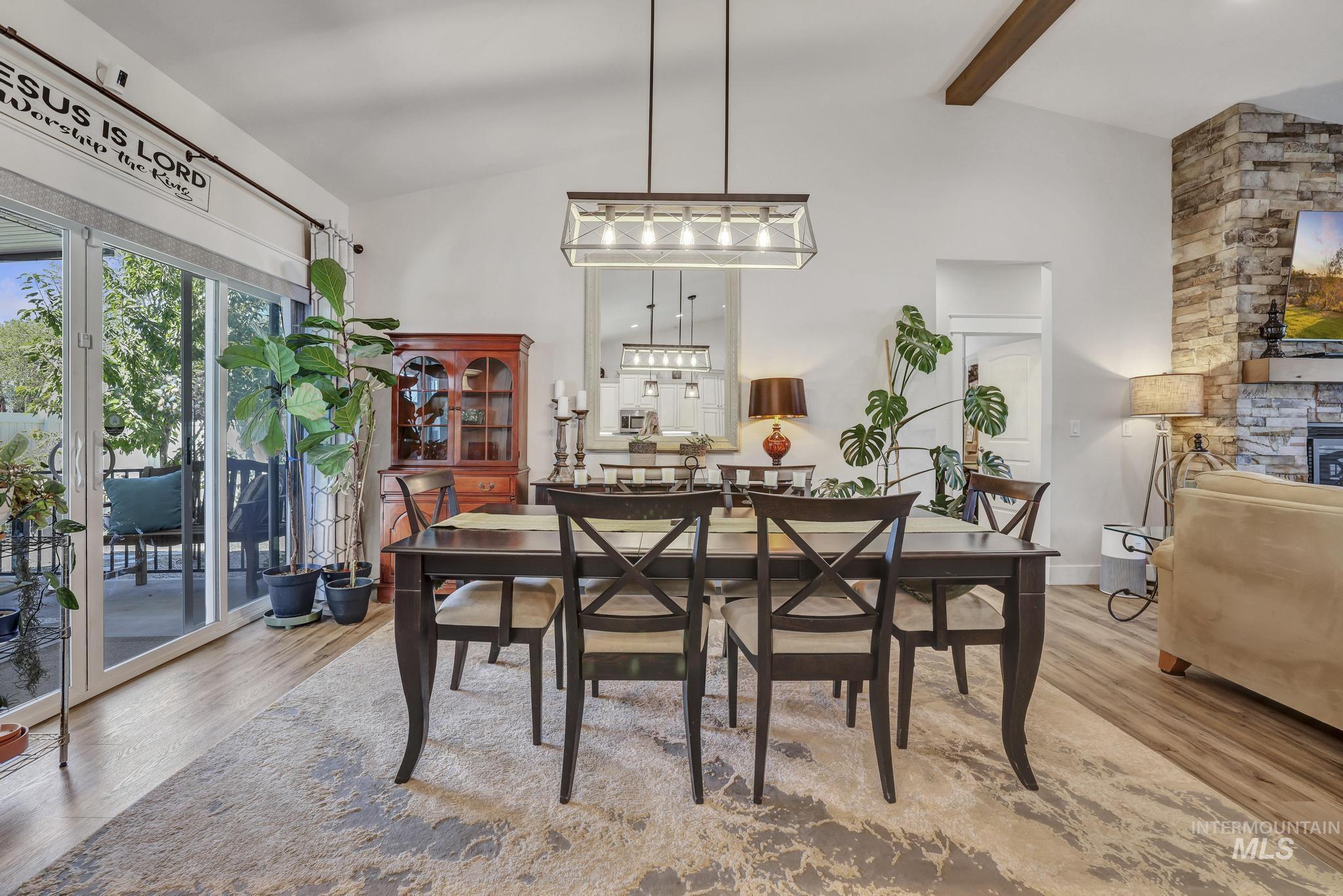 1384 Jump Street Twin Falls, ID 83301 - Photo 13 of 37 Dining room with light wood-style floors and a fireplace
