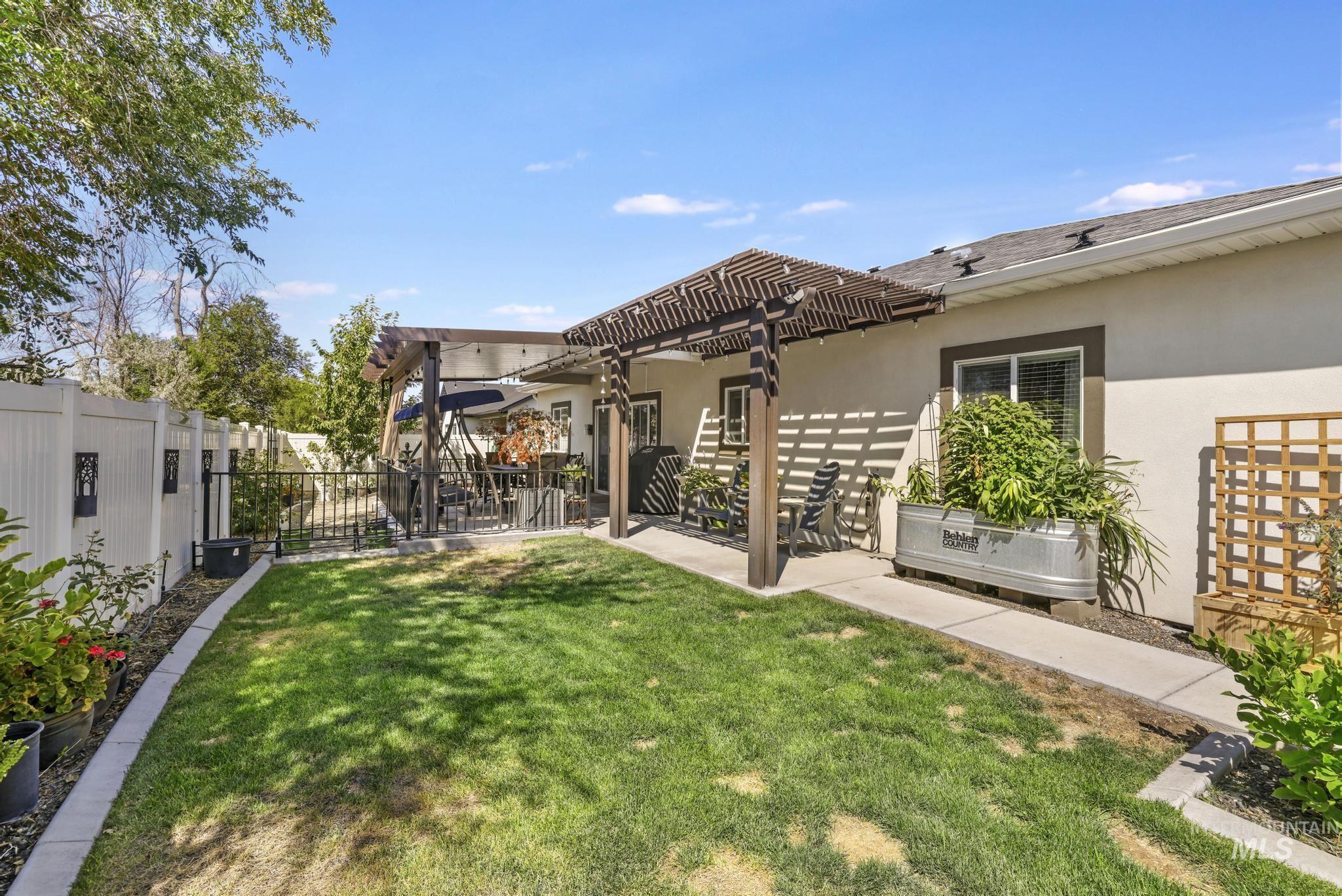 1384 Jump Street Twin Falls, ID 83301 - Photo 28 of 37 Fenced backyard featuring a pergola and a patio area